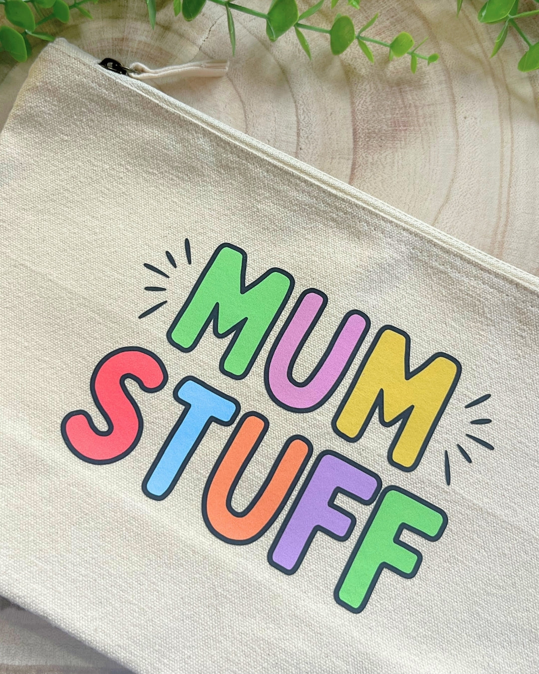Beige pouch with 'MUM STUFF' in colourful letters