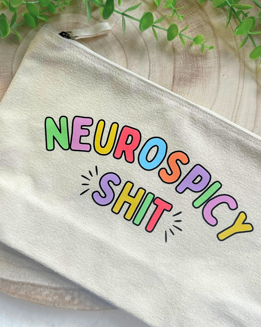 Practical canvas pouch labeled “Neurospicy Shit,” designed for organizing neurodivergent everyday essentials.